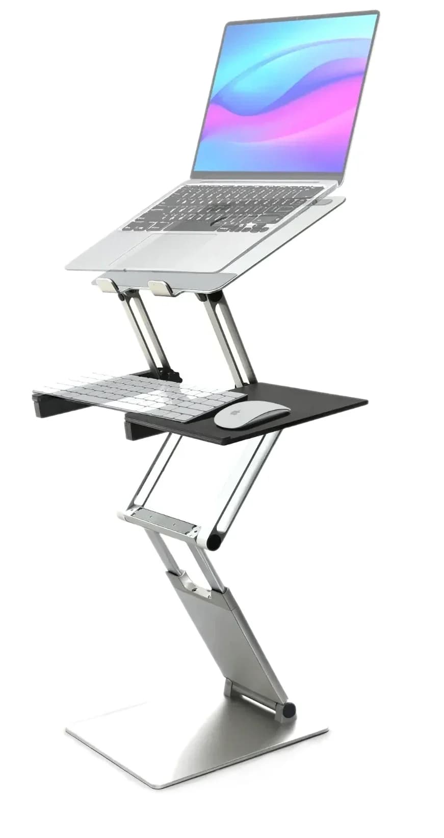 DriftDesk standing desk converter raised to full height on a desk, holding a laptop with the keyboard tray attached