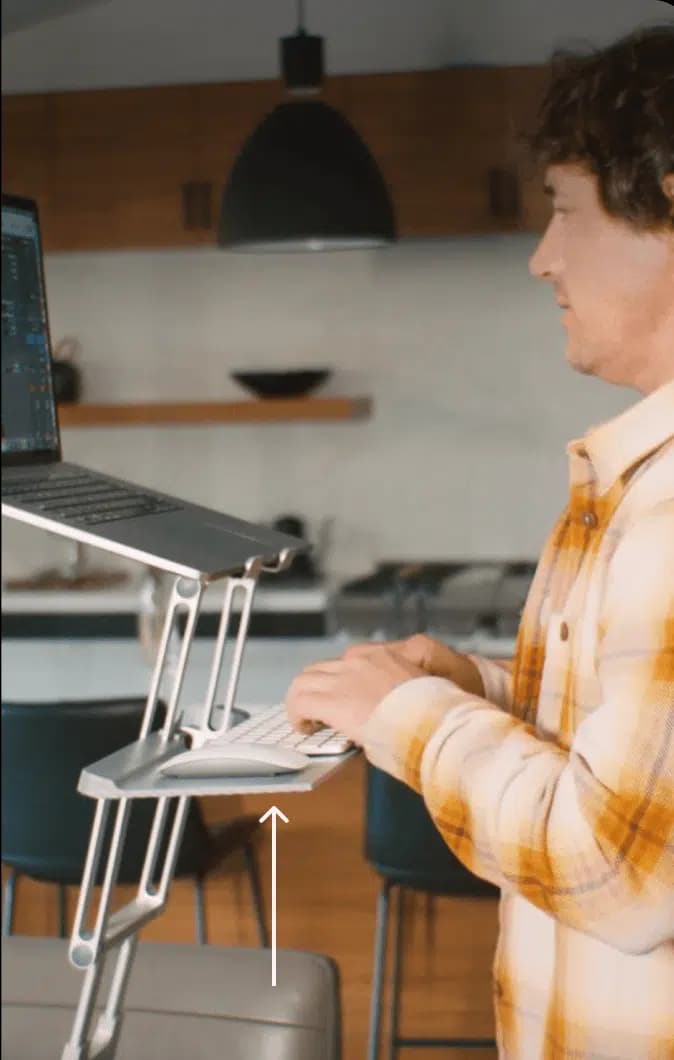The included keyboard tray in use at elbow height